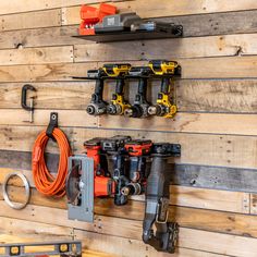 there are many tools hanging on the wall