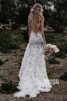 the back of a woman in a wedding dress