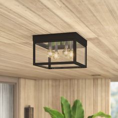 a square light fixture hanging from the ceiling