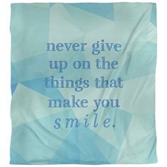 a blue and white blanket with the words never give up on the things that make you smile