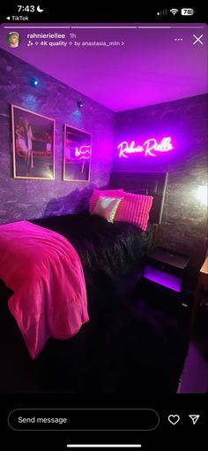 a bed room with a neatly made bed and neon lights on the wall above it