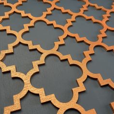 an intricate pattern made out of wood on a table