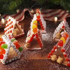 Get ready for the sweetest little houses. Get the recipe at Delish.com. #delish #easy #recipe #mini #gingerbreadhouse #gingerbread #DIY #ideas #party #decorating #grahamcrackers #forkids Mini Gingerbread House, Christmas Treats, Holiday Treats, Christmas Food, Gingerbread House Recipe