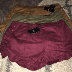 Three Colors Available Maroon Olive And Camel Soft Lightweight Shorts With A Crisscross Lace Detail On Each Side Hip & Thigh Each Feature Ruffle Trim@ The Bottom A Zipper And Loop Closure Center Rear With Slight Stretch Great Fall And Winter Colors. Easily Paired With A Thigh Boot Duster And Blouse. If You're Interested In All Three Pairs Please Message Me In A Bundle. Lace, Shorts, Winter, Lightweight Shorts, Ruffle Shorts, Thigh Boot, Duster, Ruffle Trim, Lace Detail
