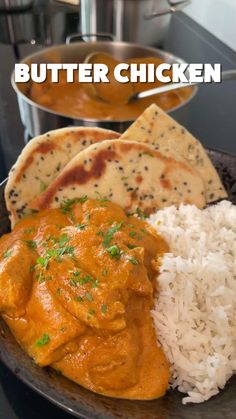 butter chicken with rice and pita bread on the side in a black plate next to an instant pressure cooker