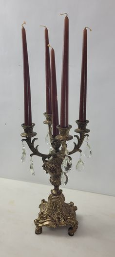 an ornate candelabra with four candles on it