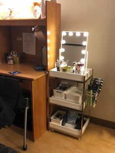 a desk with a mirror and lights on it