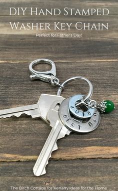 a key chain with two keys attached to it and the words diy hand stamped washer key chain perfect for father's day