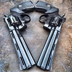 two revolvers sitting on top of each other