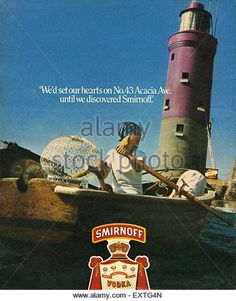 an advertisement for smirnoff vodka featuring a woman in a boat with a lighthouse behind her