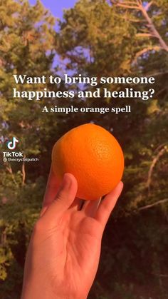 someone holding an orange up to their face with the words, want to bring someone happiness and healing?