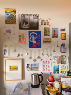 a kitchen with pictures and magnets on the wall