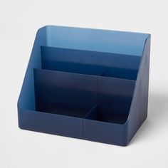 a blue desk organizer on a white surface with one section open and the other half closed