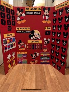 a mickey mouse themed classroom display with numbers and symbols on it's sides, along with other bulletin boards