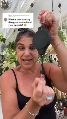 a woman holding up a frying pan in front of her face