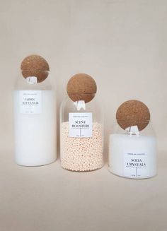 three bottles filled with different types of items