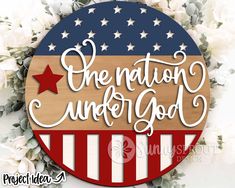 a wooden sign with the words one nation under god on it and an american flag