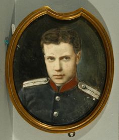 a portrait of a man in uniform is hanging on the wall next to a clock