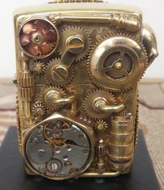 an antique clock made out of gold gears