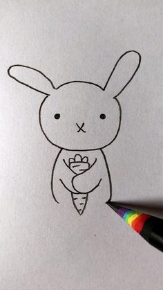 a drawing of a bunny holding a carrot
