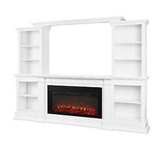 a white entertainment center with an electric fire place and built - in bookcases