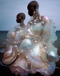 an image of two people standing next to each other with bubbles on their body and in the water