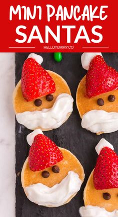 mini pancake santas with strawberries on top and chocolate chips in the middle