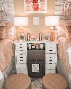 two twin beds in a small room with white drawers and brown stools next to each other