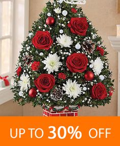 a christmas tree with red and white flowers on it is up to 30 % off