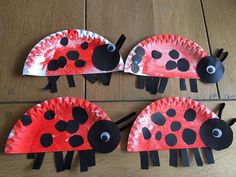 three paper plates with ladybugs on them sitting on a wooden floor next to each other