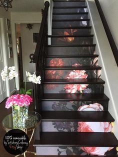 the stairs are painted with flowers on them