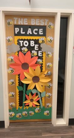 a door decorated with paper flowers and the words, the best place to be is