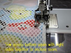the sewing machine is working on the fabric that has been sewn together with it