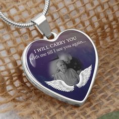 a heart shaped necklace with an image of a woman and wings on it, that says i will carry you with me till see you again