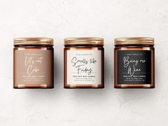 three jars of honey with labels on them sitting side by side against a white background