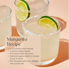 two margarita cocktails with lime slices on the rim