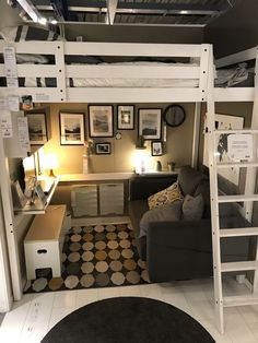 a loft bed with a desk underneath it
