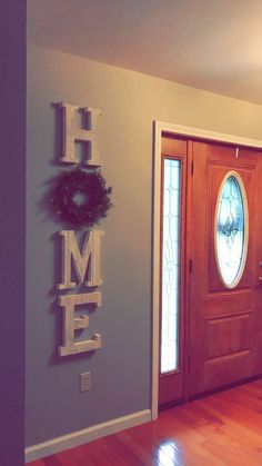a door with the word home spelled on it
