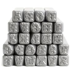 alphabets and letters are stacked on top of each other in the shape of cubes