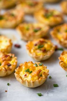 mini quiche cups on a baking sheet