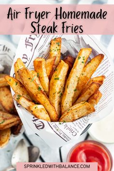 air fryer homemade steak fries in a basket with ketchup on the side