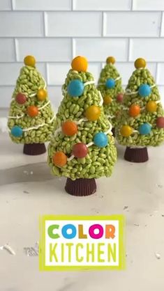 crocheted christmas trees with candy on top and the words color kitchen below them