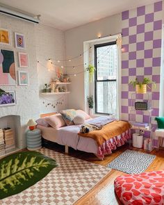 a bedroom decorated in pastel colors and patterned walls