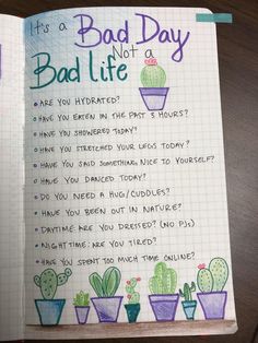 an open notebook with the words bad day not a bad life written on it