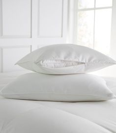 two white pillows stacked on top of each other