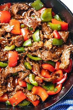a skillet filled with beef and peppers