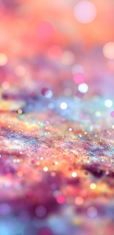 an abstract background with many colors and sparkles