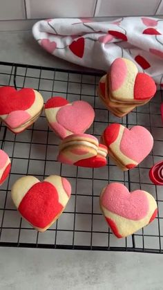"Valentine's Day sandwich cookies in heart shapes, filled with vibrant frosting, served on a plate" Valentine's Day Sugar Cookies, Valentines Day Sugar Cookies, Valentines Day Treats
