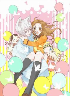 two anime characters hugging each other with balloons in the background