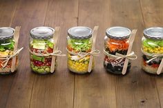 five mason jars filled with different types of food